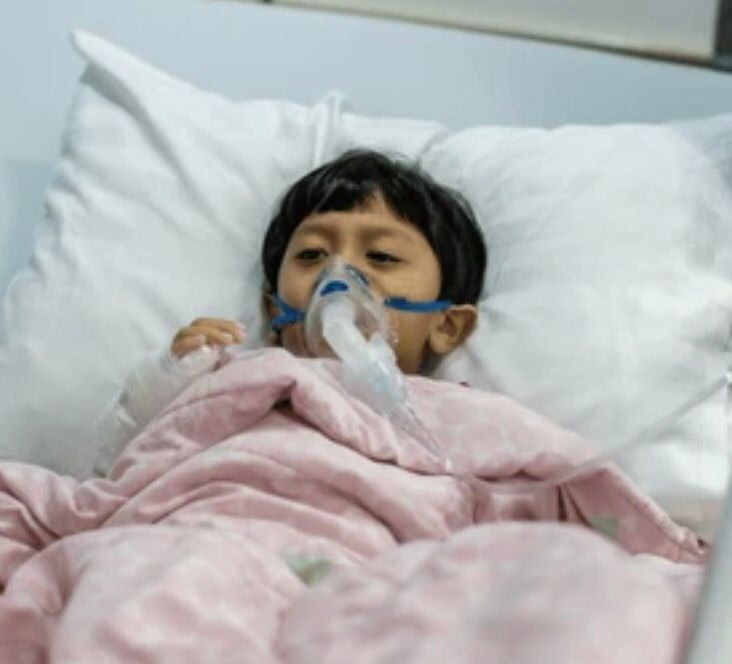 A child receiving medical care in a hospital